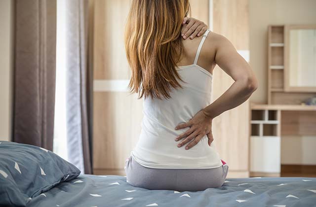 Woman in serious back pain